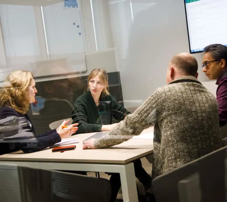 Professionals collaborating in an office at Toyota Automated Logistics