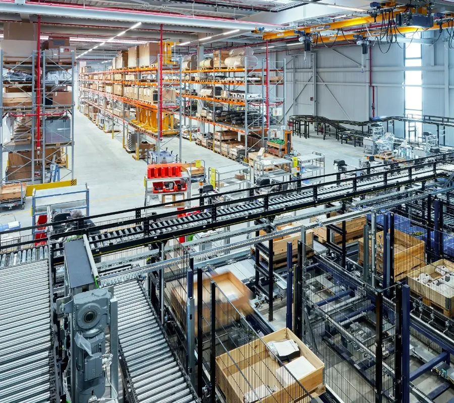 Automated conveyor systems and storage racks in a modern industrial distribution center.