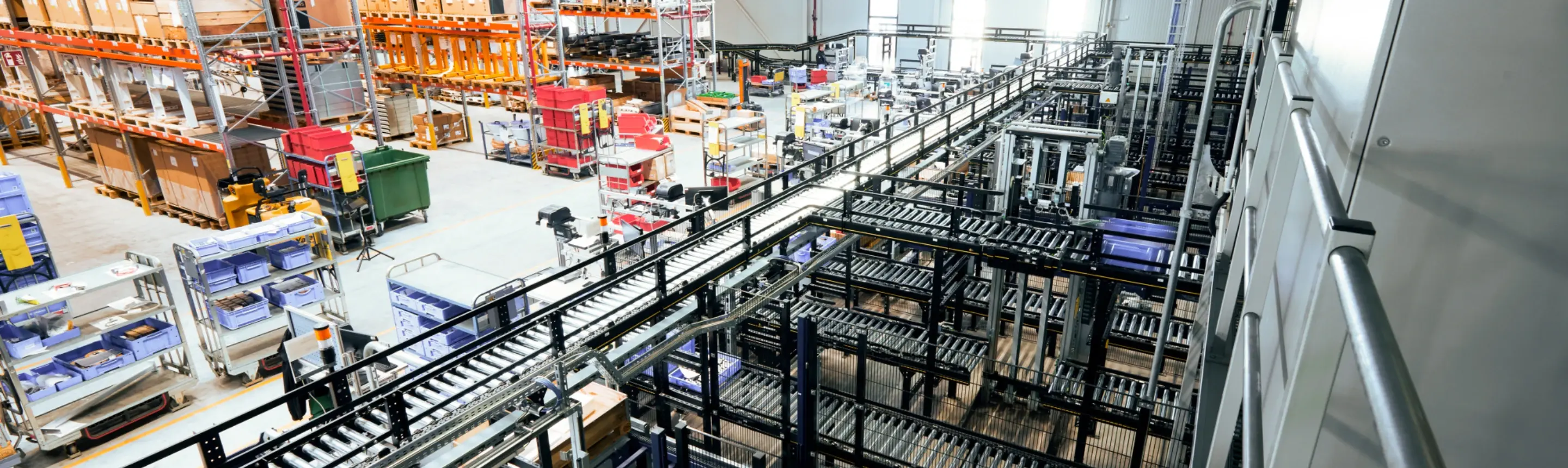 Automated conveyor systems and storage racks in a modern industrial distribution center.