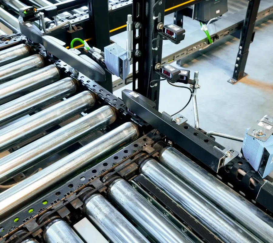 Industrial roller conveyor system with integrated sensors for automated material handling.