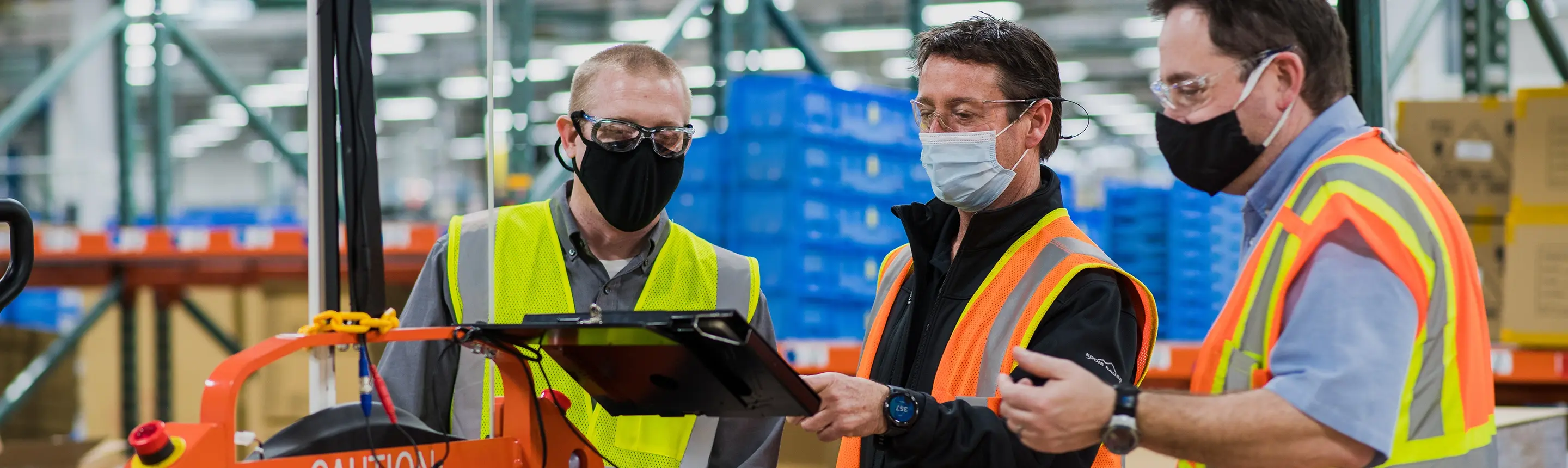 TAL engineers training client on automated vehicle system as part of warehouse automation services